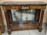 a small table with a mirror on top of it