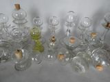 a lot of empty glass bottles with corks on them