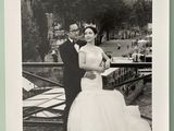 a black and white photo of a man and a woman posing for a picture