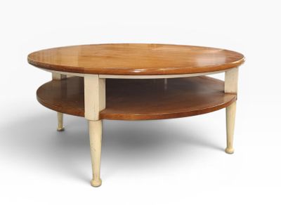an image of a round coffee table with two shelves
