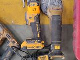 two corded drillets and two other tools on the floor