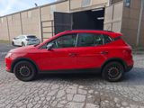 a picture of a red suv parked in front of a building