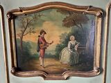 un tableau accroché au mur d'une pièce, représentant un homme et une femme