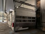 a garage door that is open in a building
