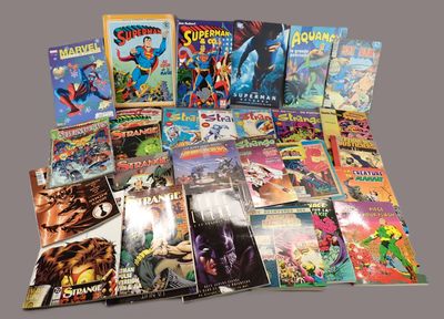 a lot of comic books that are on the table