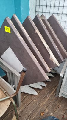 many pieces of wood stacked on top of each other on the floor