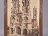 an old picture of a church with a clock tower in the background