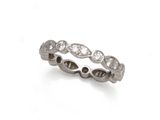 a close up of a diamond ring on a white background