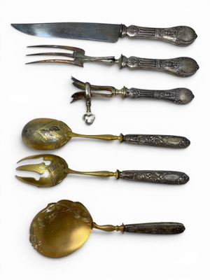 five different types of silverware on a white surface