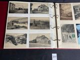an open book with pictures of trains and buildings on it
