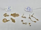 a collection of gold earrings and earrings