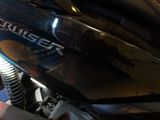a close up of a motorcycle parked in a garage
