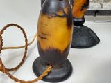 two vases that are sitting on a table
