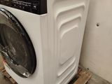 a washing machine sitting on a pallet in a room