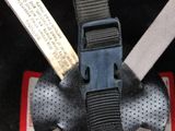 a close up of a helmet with a belt attached to it