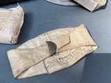 a pair of gloves and a wallet on a table