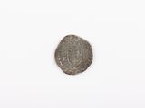 a close up of a coin on a white surface with a white background