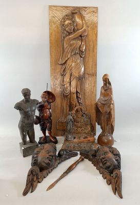 a statue of jesus on a pedestal with other statues