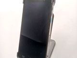 a cell phone that is sitting on top of a stand