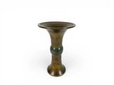 an image of a small bronze vase on a white background