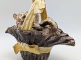 a vase that has some kind of animal inside of it