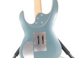a blue guitar that is on a stand on a white background
