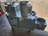 une machine sur laquelle sont fixés deux godets