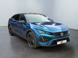 the blue car is parked in a large room with a black floor