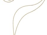 un collier composé d'une perle noire et d'une chaîne en or