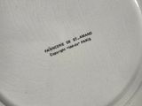 a white plate with a black writing on it