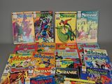 a lot of comic books that are on the table