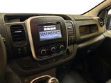 the interior of a car with a steering control and dashboard controls