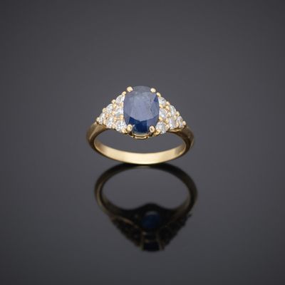 a sapphire and diamond three stone ring