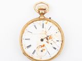 a gold pocket watch with roman numerals on it