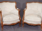 paire de chaises anciennes de style français à accoudoirs rembourrés