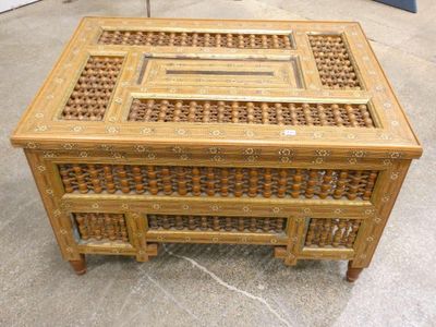 an image of a wooden coffee table with a glass top