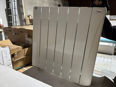 a white radiator sitting on a table in a room