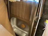 a box with a toilet inside of it and a box with a toilet inside of it