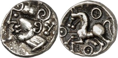 a close up of a silver coin with a horse on it