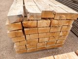 several pieces of wood stacked on top of each other in a pile