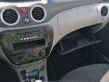 a dashboard of a car with a steering wheel and dashboard controls