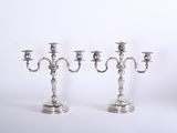 three silver candelabs on a white background with a white background