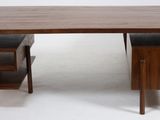 an image of a desk with a chair and a book shelf