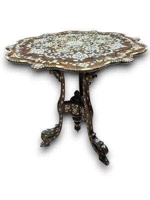 an image of a table with a flower design on top of it