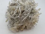 a close up of a ball of yarn on a white surface