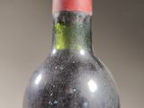 a bottle of wine that is sitting on a table