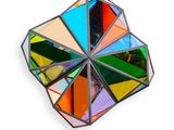 an image of a multicolored glass object on a white surface