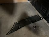a piece of metal sitting on the floor next to a stove
