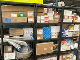 many boxes and packages on the shelves in the warehouse
