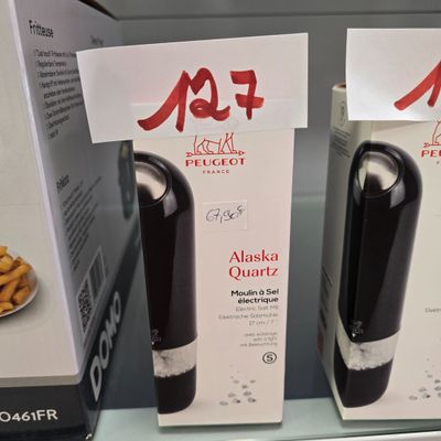 bottles of wine are on display in a store for sale